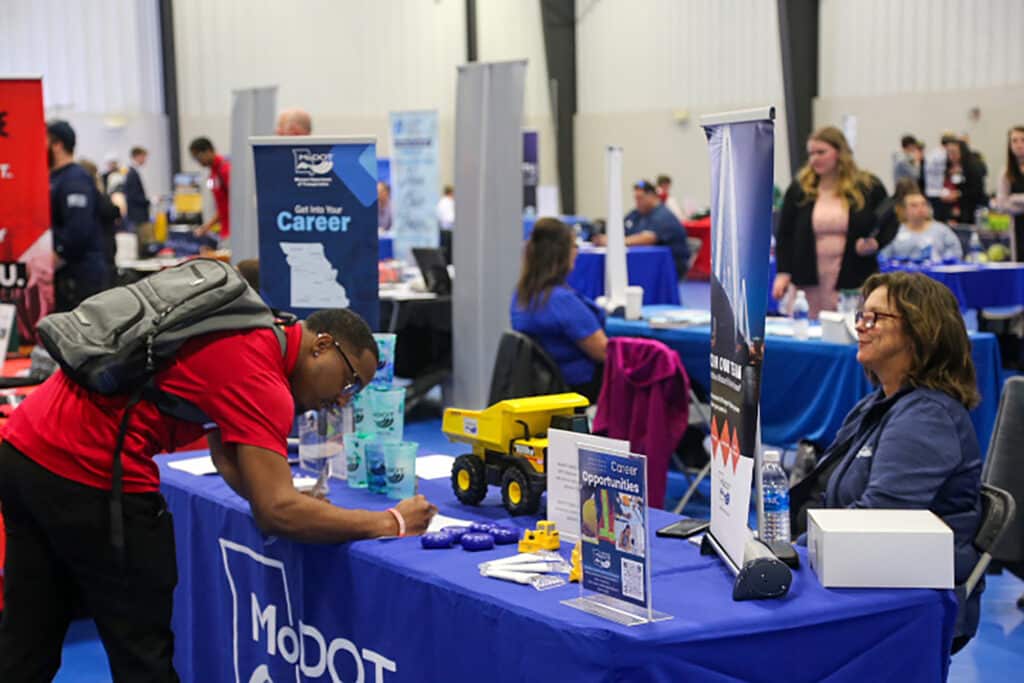Photo of student filling out information at the Culver-Stockton College 2025 Tri-State Career Fair