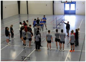 Seth McBride (right, pictured with his arm in the air), Director of the Culver-Stockton College Center for Public Safety and Chair of the Criminal Justice Department, with students at the 2026 Fallen Officer Project’s pickleball tournament, held April 19 at C-SC. 
