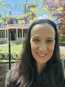 Selfie of Dr. Alissa Burger in front of the Stephen King Mansion.